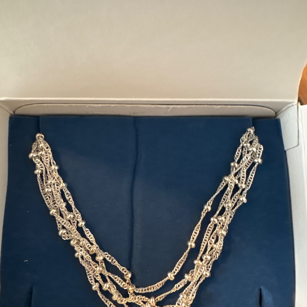 Silver tone multi strand necklace with length adjuster